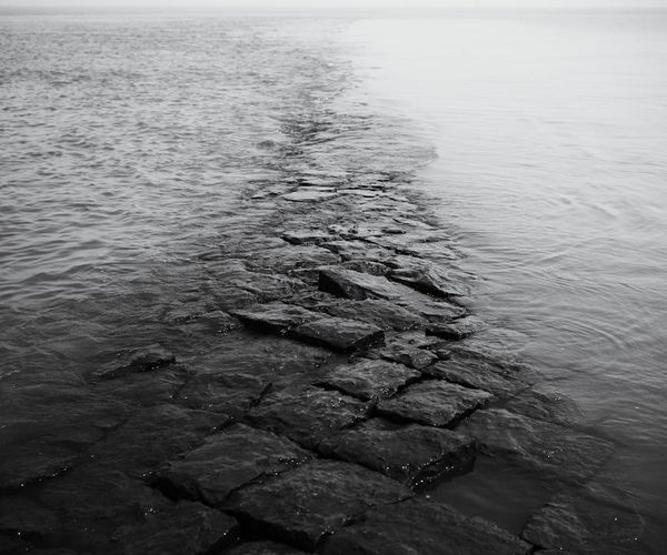 Calm serene landscape with a path leading towards the horizon.
